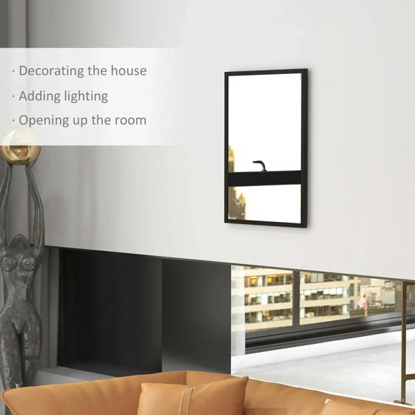 Rectangular black wall mirror mounted on wall with partial room reflection