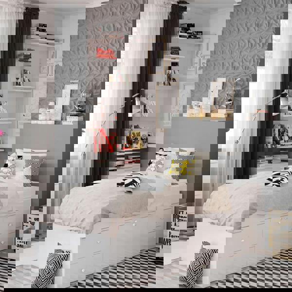 White bed frame in a modernly decorated bedroom.