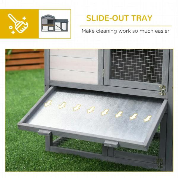 Grey rabbit hutch with slide-out cleaning tray under the lower wire enclosure