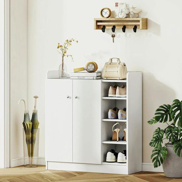 White shoe cabinet with 2 doors and open shelving, storing shoes on multiple levels.