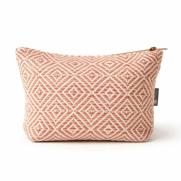 Coral jacquard toiletry bag with diamond geometric pattern and gold zipper