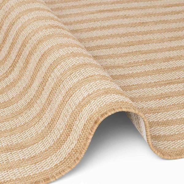 Close-up of a textured beige and white rug with wavy pattern on a white background