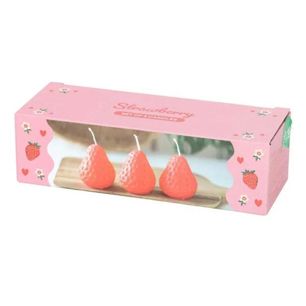 Strawberry-shaped candle set gift box with three red candles visible
