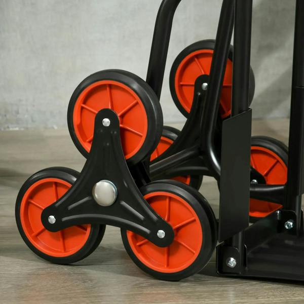 Close-up of stair hand truck wheels: black frame with orange-red wheel rims