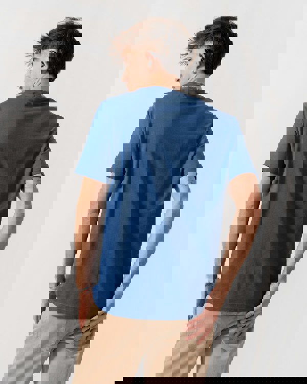 Back shot of Model wearing a GANT Mens Regular Fit Short Sleeve Shield Logo T-Shirt in Vintage Blue