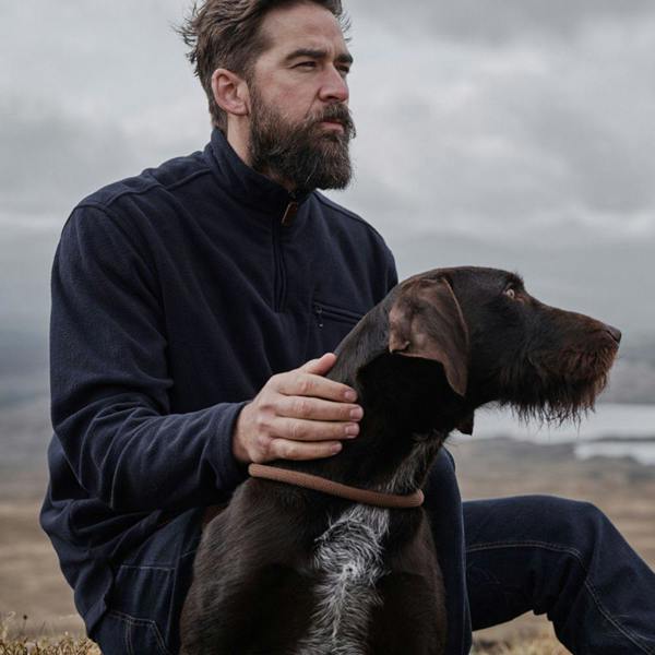 Model wearing Hoggs of Fife Islander TechPro shirt in Navy, breathable stretch fabric with 1/4 zip for farming and outdoor use