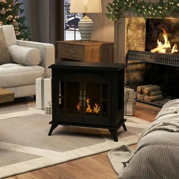 Black freestanding bioethanol stove with burning flame, angled front view