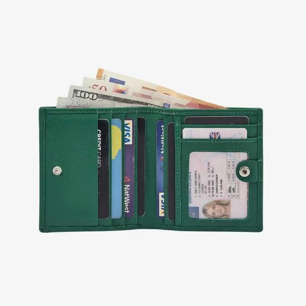 Green wallet with cards and money on a white background