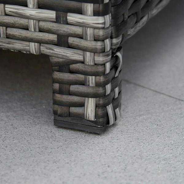 Close-up of grey wicker ottoman leg base with woven rattan pattern