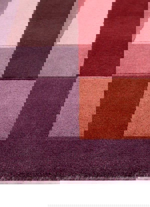 Hand-carved multicolour geometric wool rug showing rich textures and a block design, ideal for modern interiors.