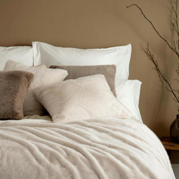 Ivory Faux Fur Cushions - winter, double, styled in a bedroom | Soak and Sleep