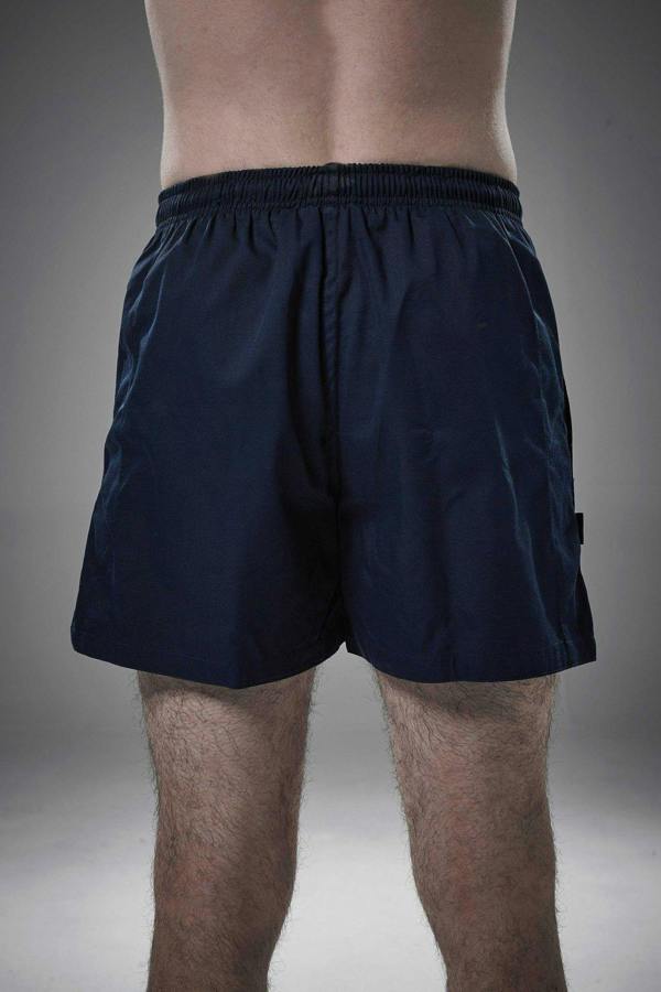 Man wearing navy Optimum Auckland rugby shorts, back view on grey studio background - Optimum