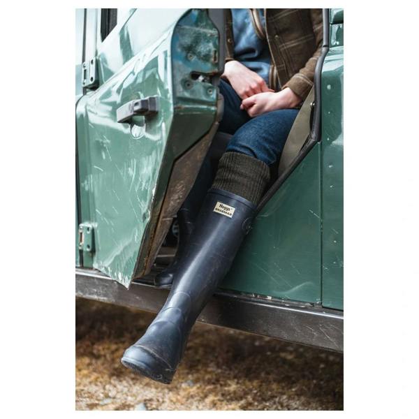 Hoggs of Fife Braemar Pro Wellington Boots in navy worn while sitting in a Land Rover
