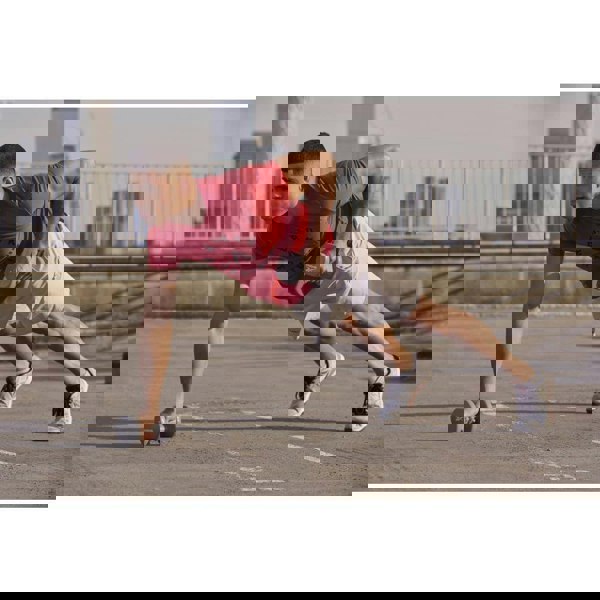 Man exercising outside using Reebok 4kg Dumbbells