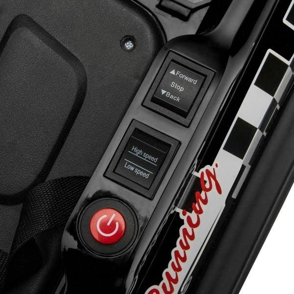 Close-up of bumper car control panel with speed buttons and power switch