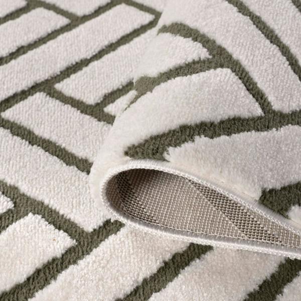 Close-up of a textured rug with geometric pattern
