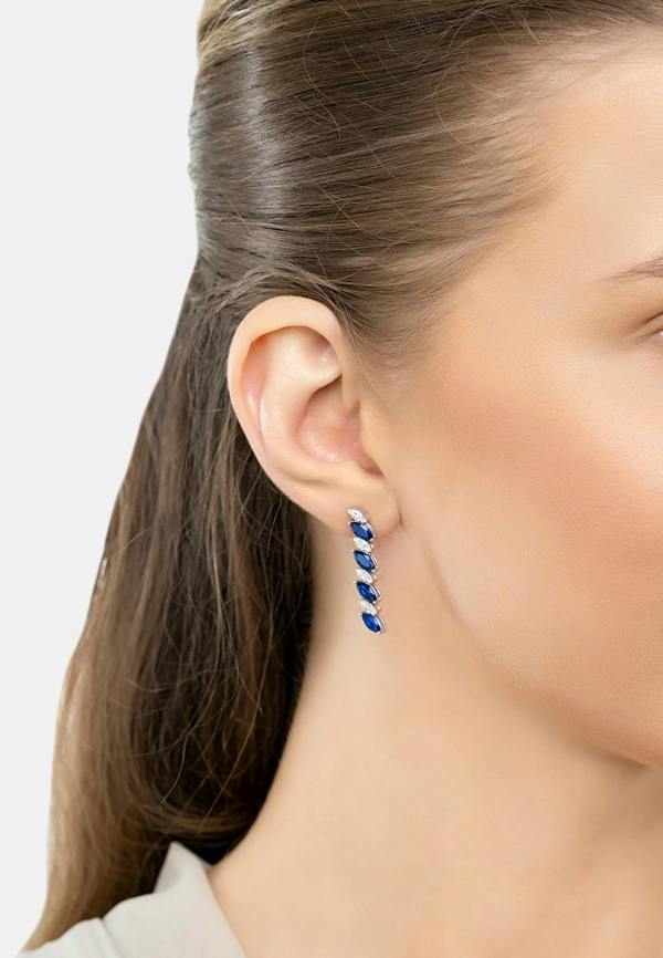 The earring worn by a model.