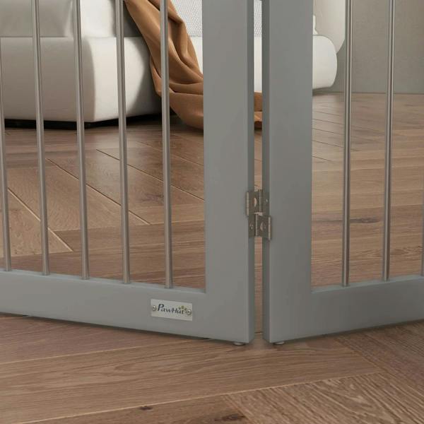 Grey pet gate base with metal latch and support feet