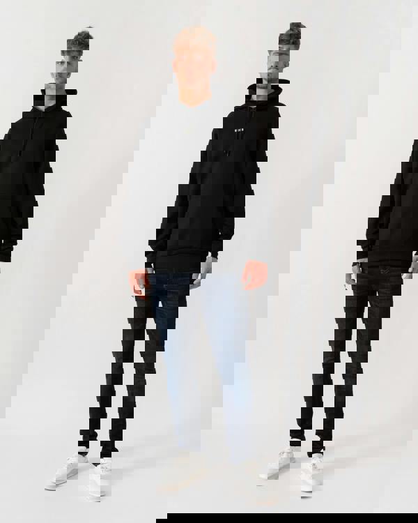 Model wearing BOSS Green Sly Zone Mens Pullover Hoodie in Black 002 - Full Length