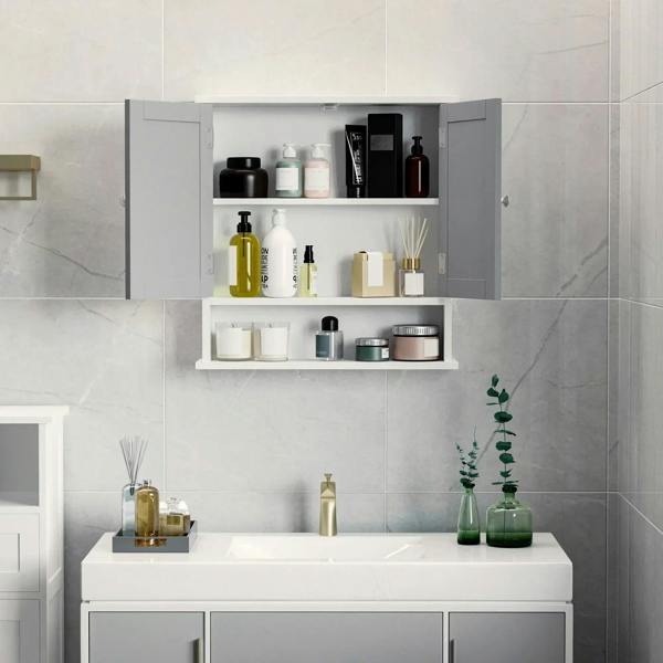 Bathroom wall storage cabinet with grey interior shelves behind mirrored door panels