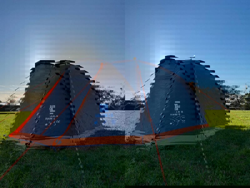 Hallow 2.0 - image of tent with sun behind