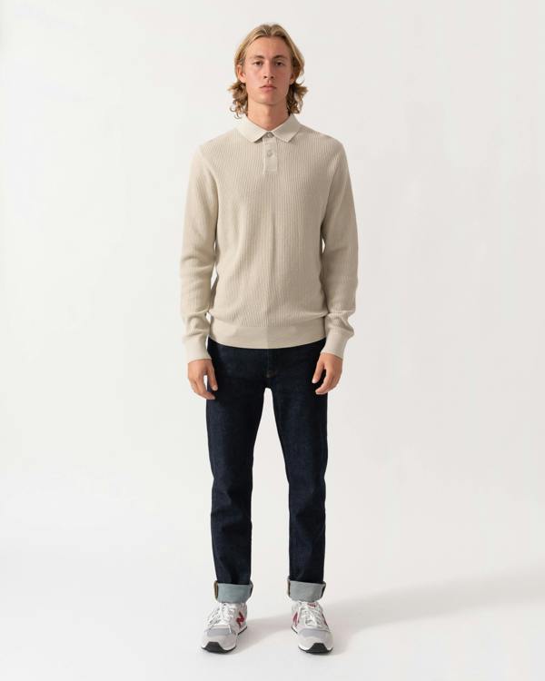 Model wearing the BOSS Orange Afedro Mens Long Sleeve Knit Polo Shirt - Light Beige 271