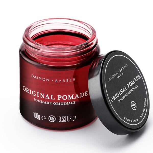 Opened jar of Original Pomade on white background