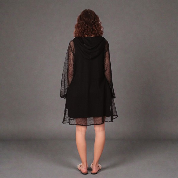 Women's Black Holiday Resort Dress with matching black undergarment.Shown from the back. Plain Background.