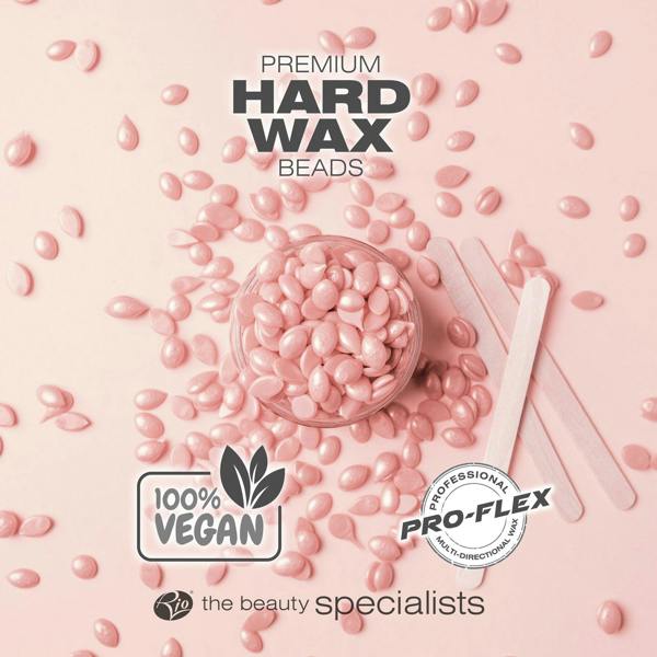 Rose premium hard wax beads laid out with spatulas labelled 100% vegan and professional pro-flex wax