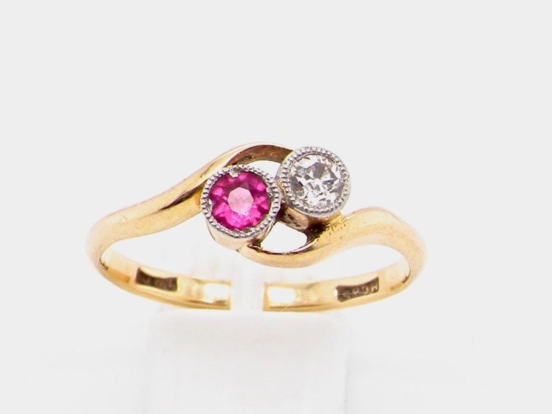 Vintage Tom A vintage two stone ruby and diamond cross over ring