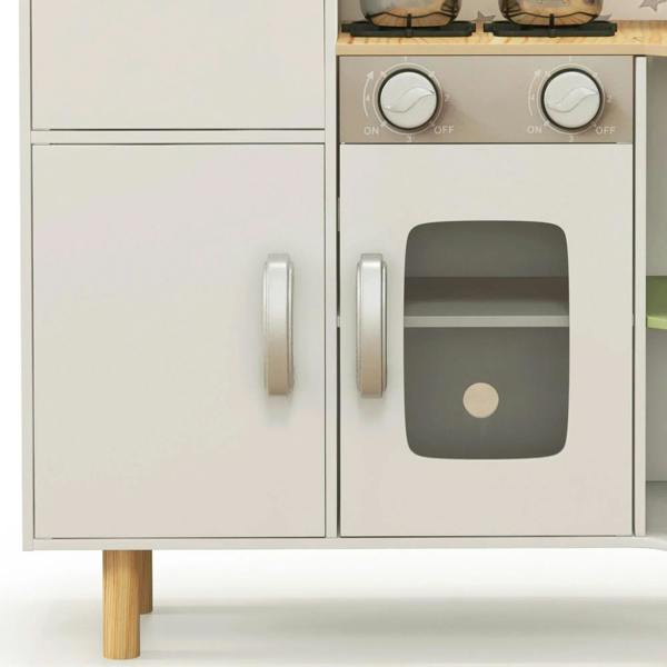 White play kitchen lower doors with gray oven window and round stovetop knobs above