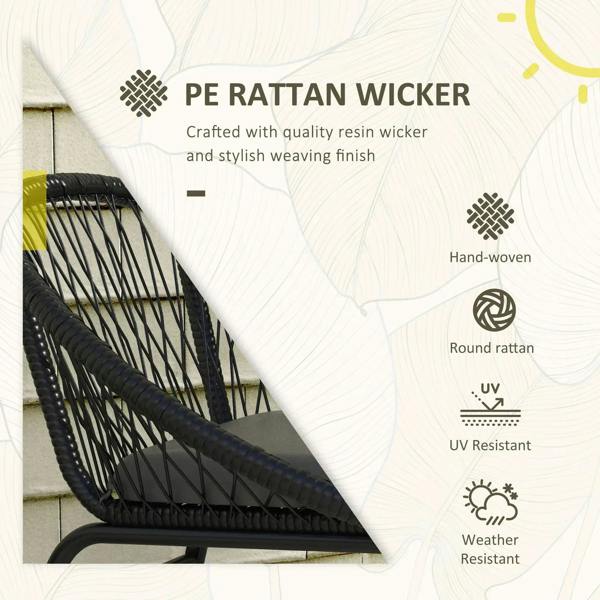 Black rattan wicker armchair weave detail with curved armrest and dark seat cushion