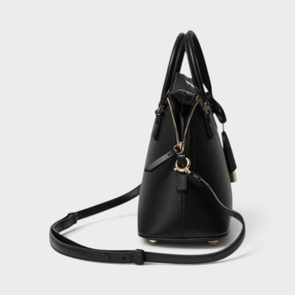 Supplied Fashion black 5AC mini tote bag shown from the side with a detachable shoulder strap and gold hardware.