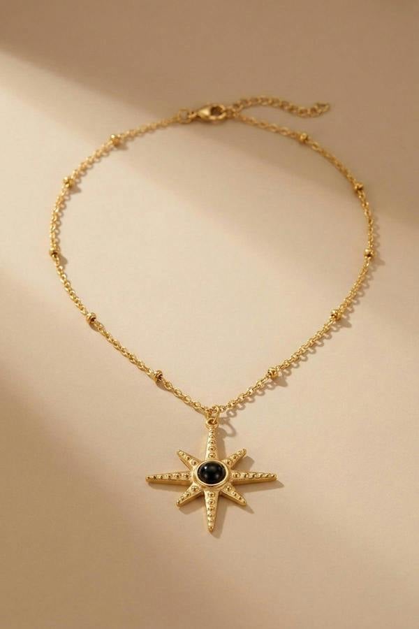 ARIIRA Gaia Gold Tone Starburst Pendant Necklace