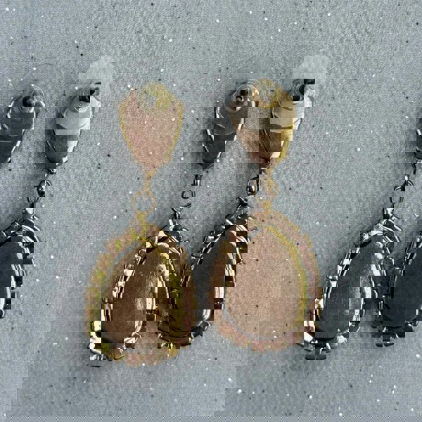 Gold drop earrings, teardrop shape, smooth polished finish, beaded edge detailing, statement jewellery design, vintage inspired style, elegant accessory for evening wear or gift for her
