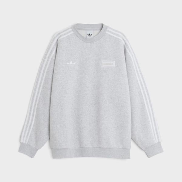 Supplied Fashion grey oversized adidas crew sweatshirt with Oasis tour branding and signature three-stripe sleeves.