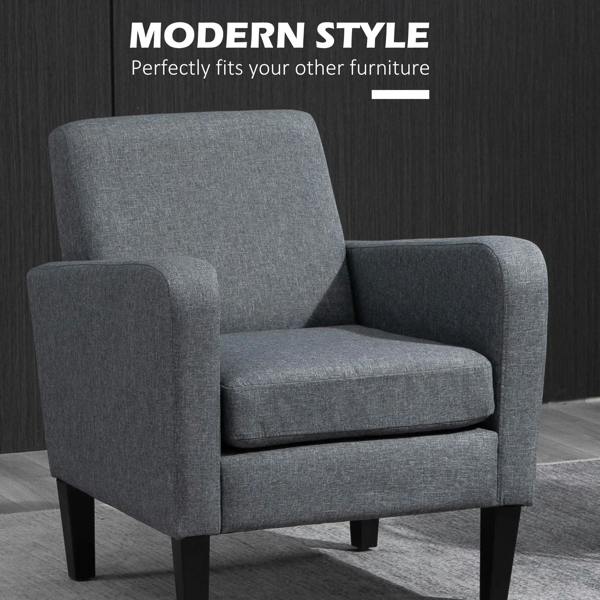 Grey upholstered accent chair with high backrest and thick seat cushion