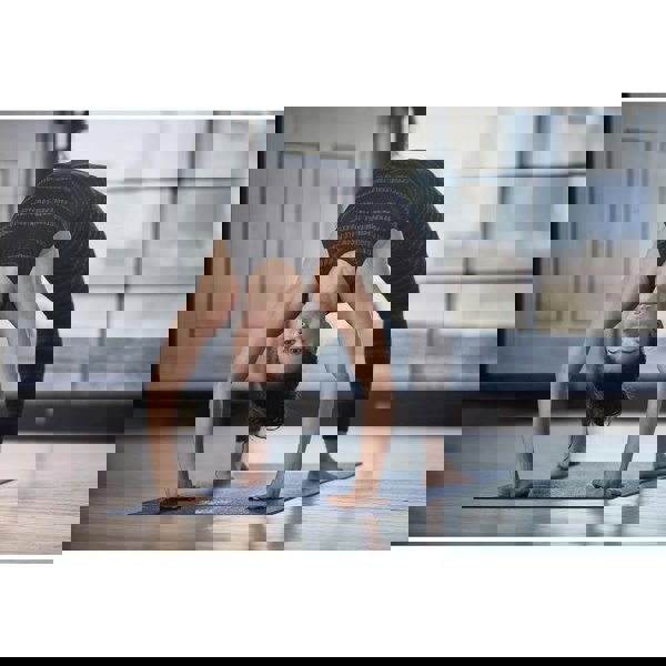 Woman doing a yoga pose on a Reebok 4mm Yoga Mat - Brush Strokes