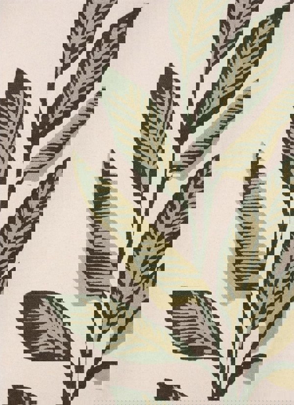 Hand-tufted cream and green wool rug featuring elegant leaf design, perfect for adding natural beauty to indoor spaces.