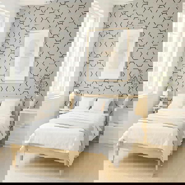 Modern bedroom with light wood bed, white bedding, and geometric wall pattern.