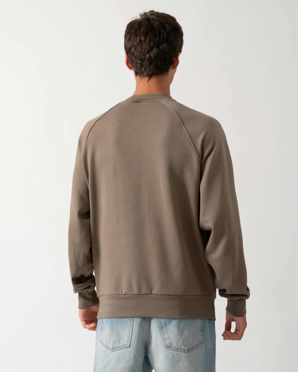 back of a model wearing a Moose Knuckles Mens Yul Crewneck Sweatshirt in Ashen 1968