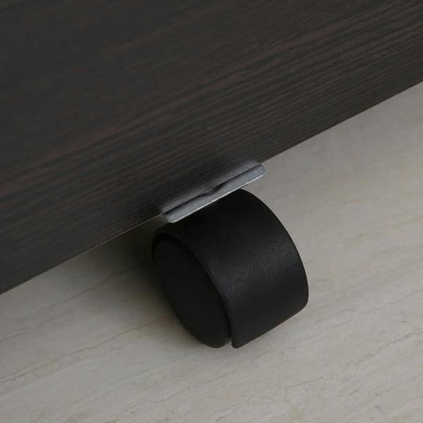 Caster wheel under dark wood-grain filing cabinet for smooth rolling