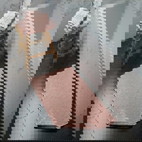 Pink bath mat made from organic cotton. Modern, sustainable homeware.