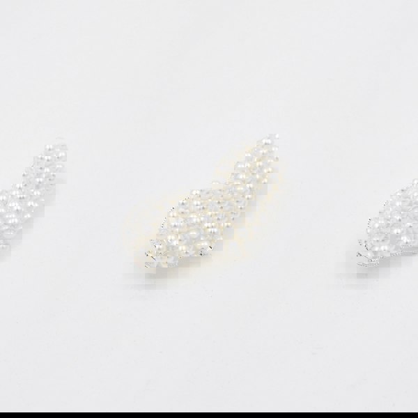 pearl heart hair clip, side view, faux pearl barrette, elegant hair accessory, silver clasp hair clip, vintage style hair slide, bridal hair accessory, decorative pearl clip
