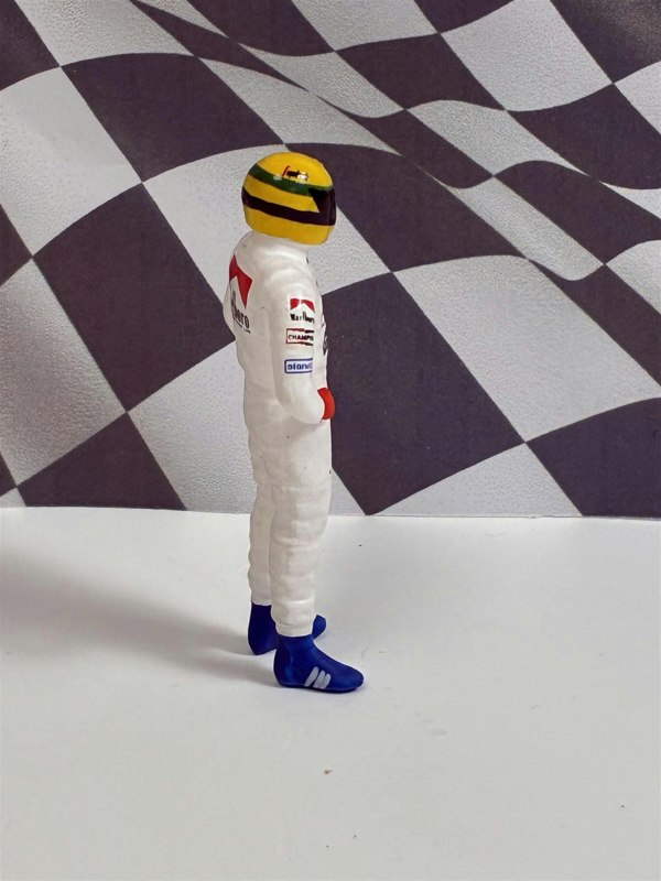 a toy figure of a man wearing a helmet