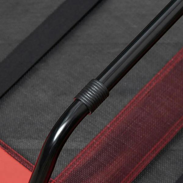 Close-up of red elevated dog cot with black steel frame and rounded leg cap