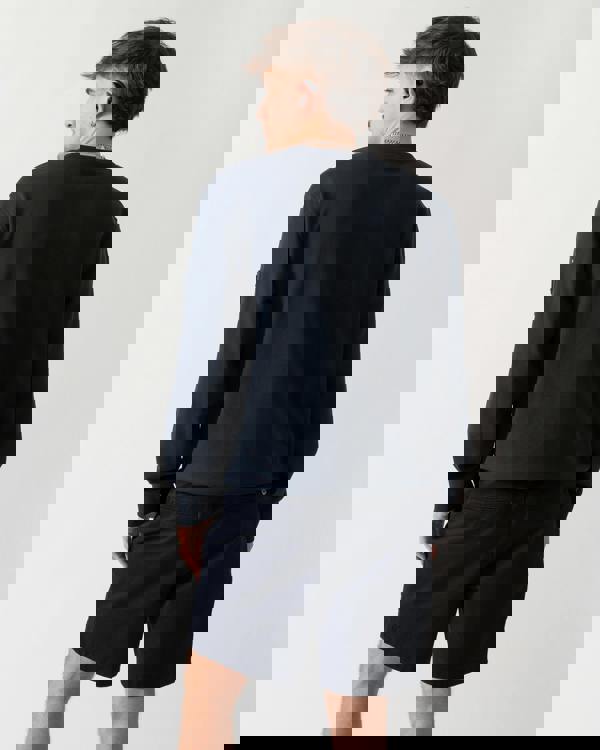 back shot of a model wearing a Moose Knuckles Hartsfield Mens Crew Neck Sweatshirt in Navy 833