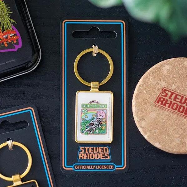 Gold keyring with square recycling-themed enamel charm, on retail card packaging