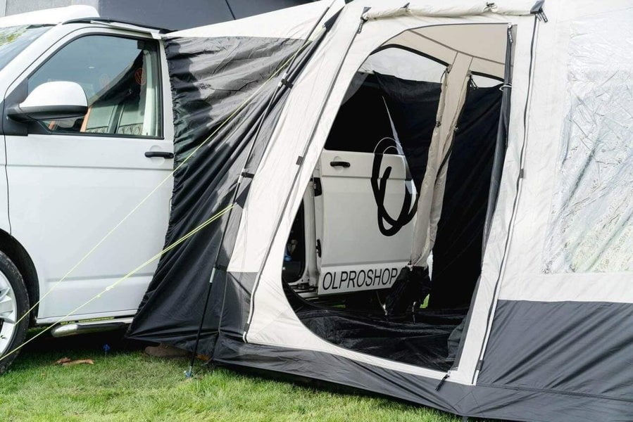 The OLPRO Cubo Campervan Awning attached to a VolksWagen T5 with the doors and fly mesh open.