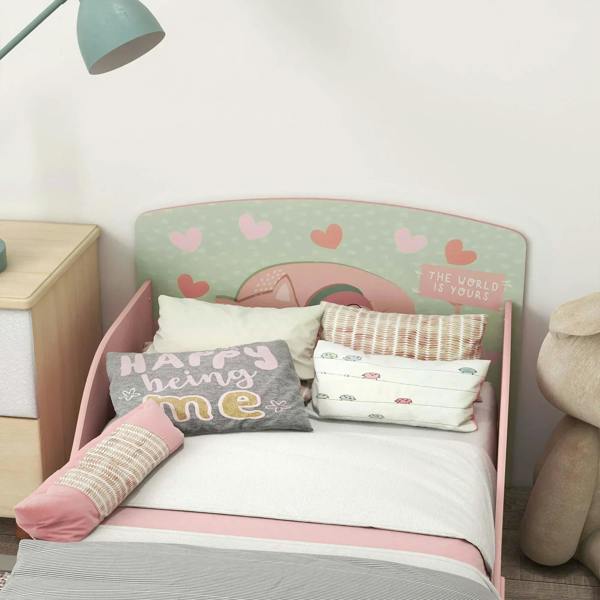 Pink toddler bed frame with heart-patterned headboard insert and fabric guard rails